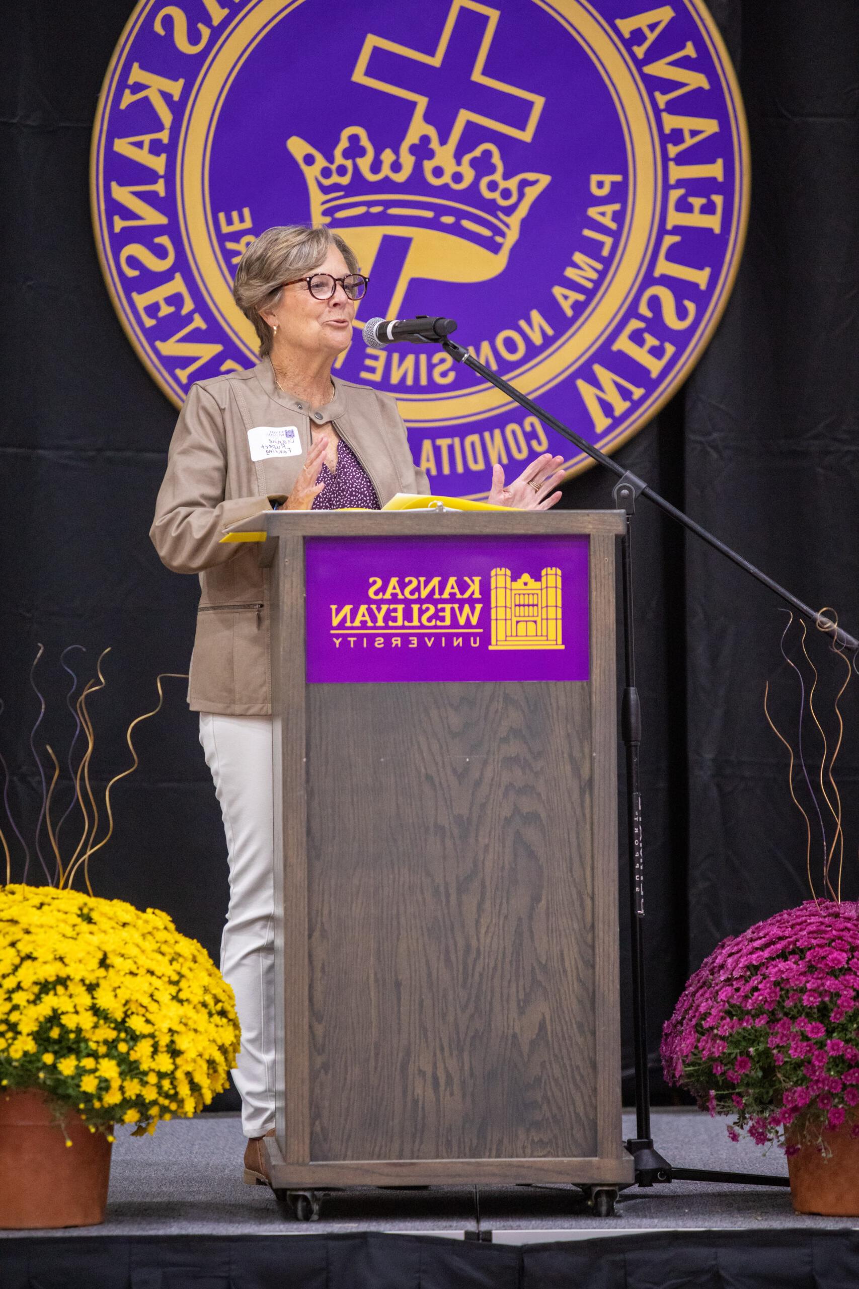 Woman speaking at podium